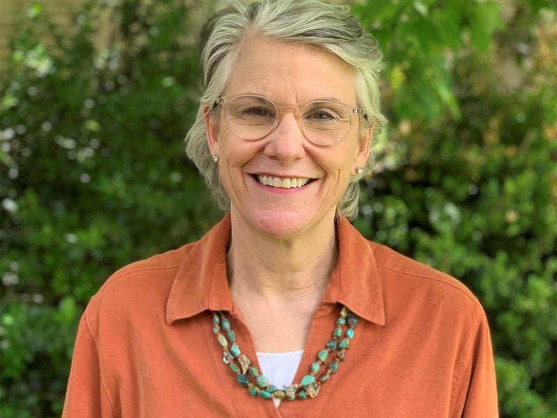 Carolyn Connerat in burnt orange blouse