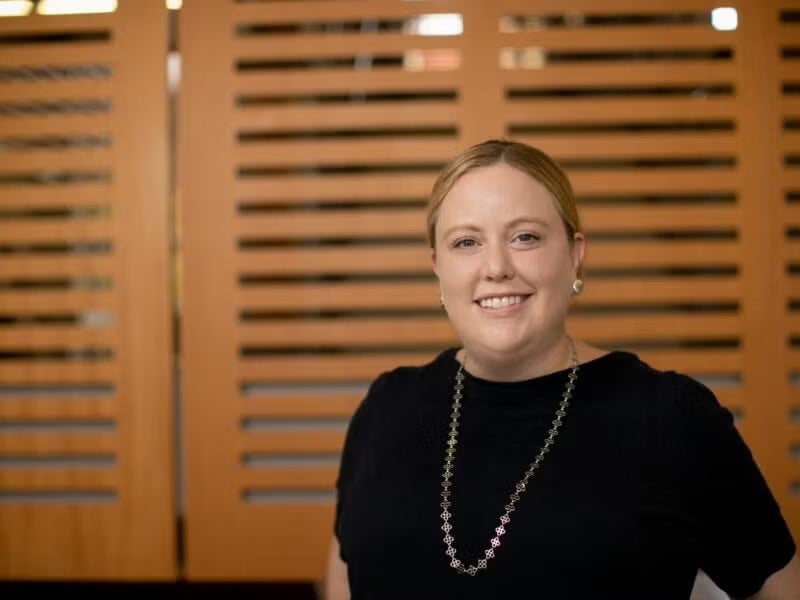 Kate Calder smiles in a headshot photo taken on UT campus.