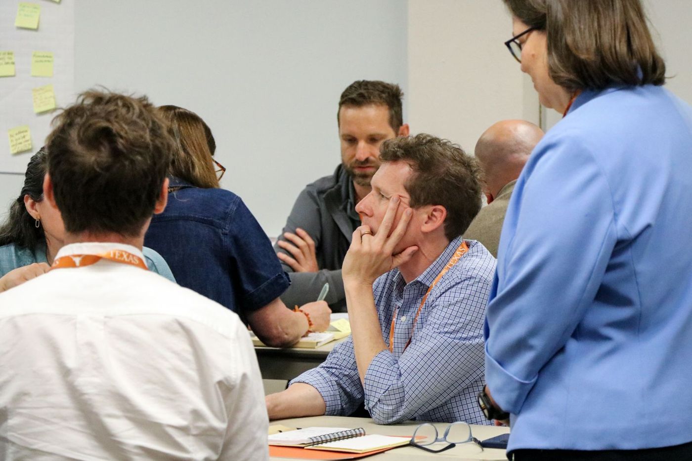 Faculty working together at a table discussion